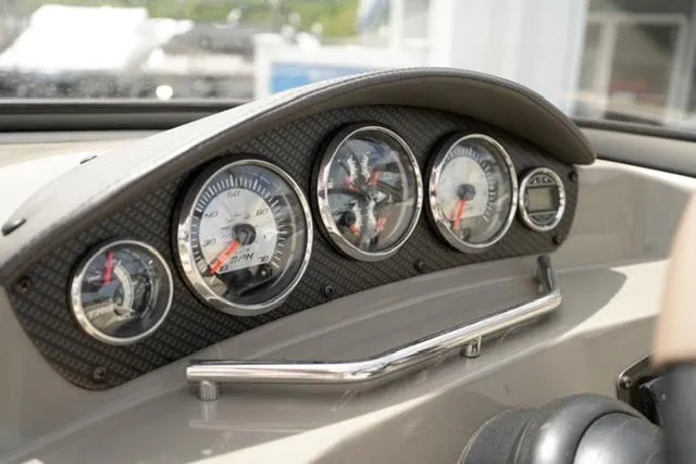Slide: The Image of Dashboard of a 2016 Stingray 208LR boat with multiple gauges and chrome accents. - 9