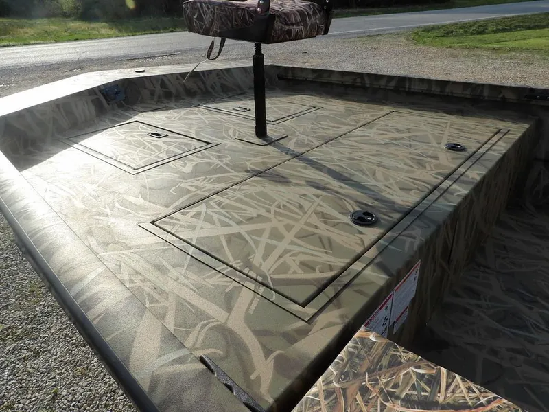 Slide: The Image of 2025 Crestliner 2070 Retriever SCHD boat with camouflage deck design. - 11