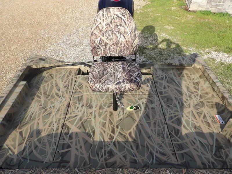 Slide: The Image of 2025 Crestliner 2070 Retriever SCHD boat with camouflage seating and deck. - 12