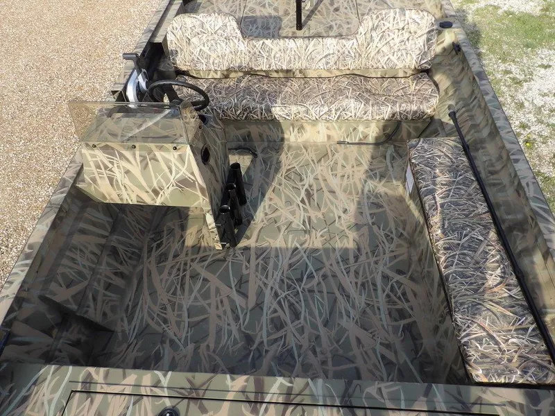 Slide: The Image of 2025 Crestliner 2070 Retriever SCHD boat with camouflage interior design. - 13
