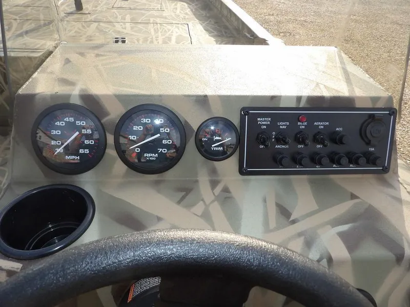 Slide: The Image of Dashboard of 2025 Crestliner 2070 Retriever SCHD boat with gauges and controls. - 16