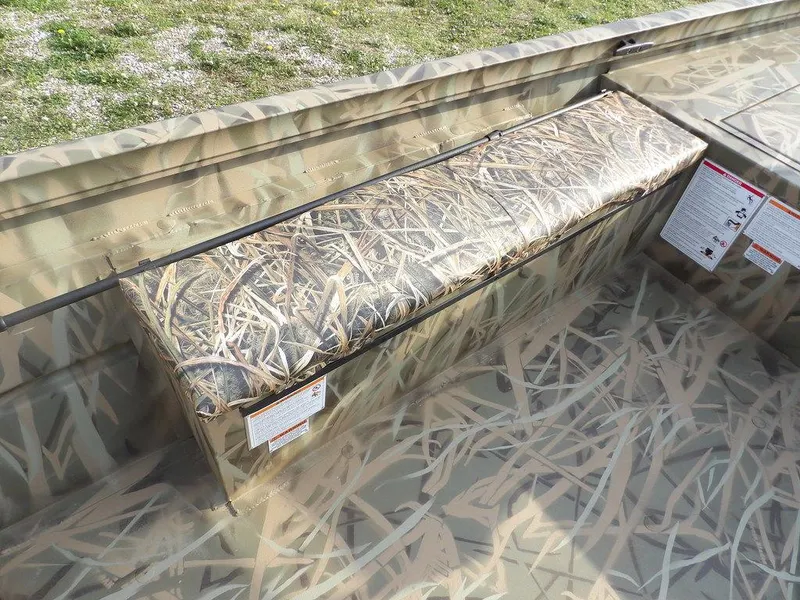 Slide: The Image of Crestliner 2070 Retriever SCHD 2025 boat with camouflage seating and storage. - 20