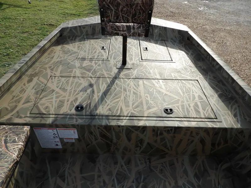 Slide: The Image of 2025 Crestliner 2070 Retriever SCHD boat with camo deck and seating. - 22