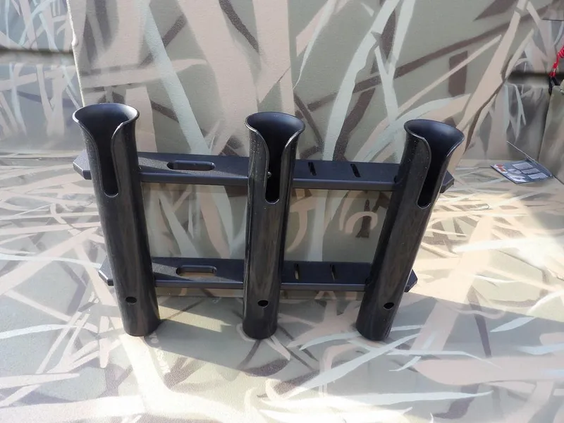 Slide: The Image of Rod holders on a 2025 Crestliner 2070 Retriever SCHD boat with camouflage pattern. - 28