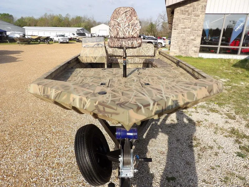 Slide: The Image of 2025 Crestliner 2070 Retriever SCHD boat with camouflage design on a trailer. - 3