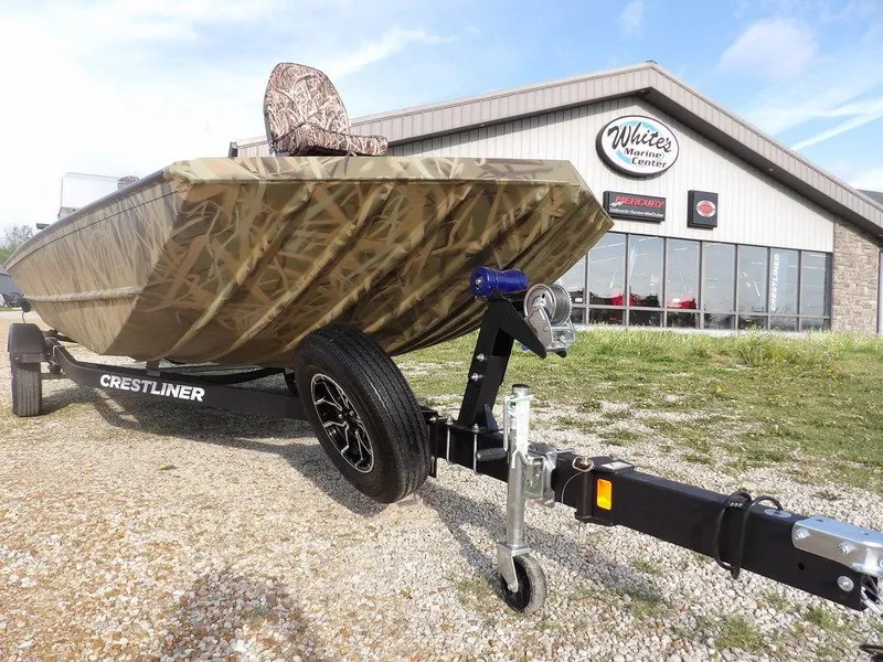 Slide: The Image of 2025 Crestliner 2070 Retriever SCHD boat on trailer, camo design, parked outside dealership. - 33