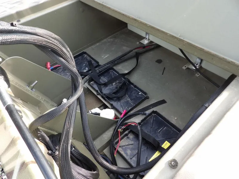 Slide: The Image of Battery compartment of 2025 Crestliner 2070 Retriever SCHD boat with wiring visible. - 38