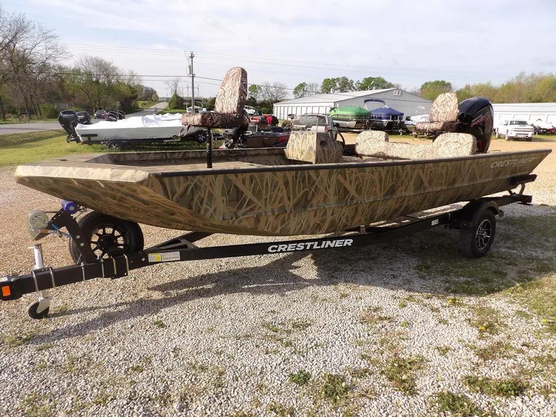 Slide: The Image of 2025 Crestliner 2070 Retriever SCHD boat with camouflage design on a trailer. - 4