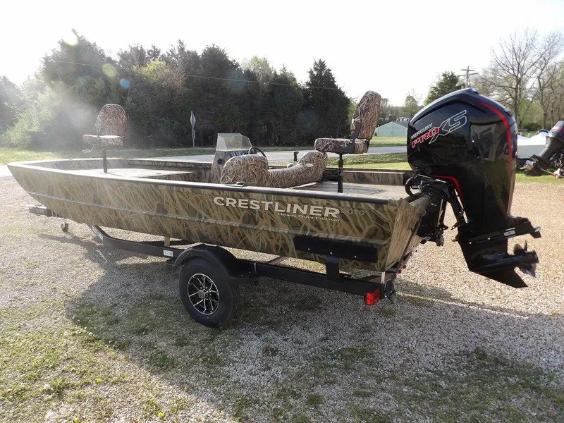 Slide: The Image of 2025 Crestliner 2070 Retriever SCHD boat with camo design on a trailer. - 6