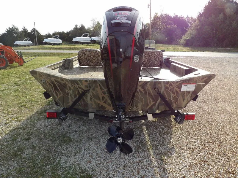 Slide: The Image of 2025 Crestliner 2070 Retriever SCHD boat with camouflage design and powerful outboard motor. - 7