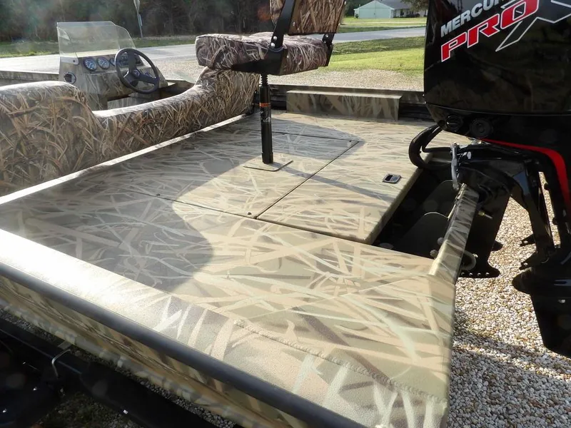 Slide: The Image of 2025 Crestliner 2070 Retriever SCHD boat with camouflage design and Mercury Pro motor. - 9