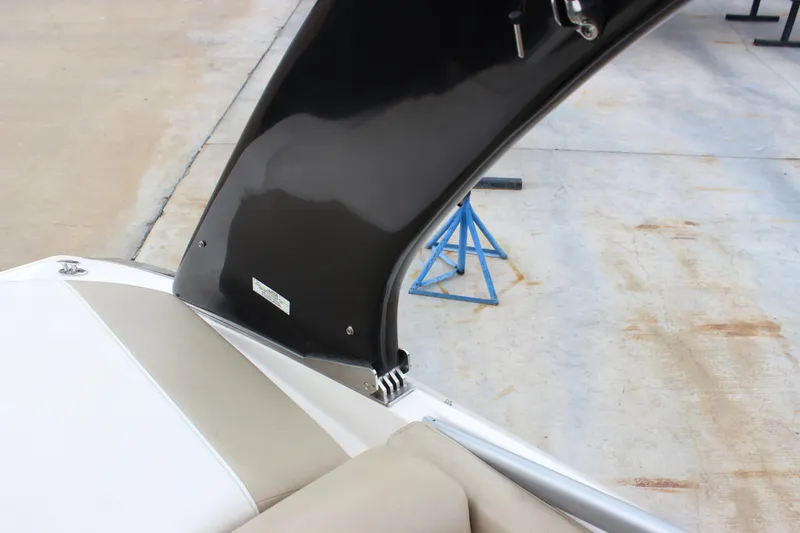 Slide: The Image of 2012 Regal 2100 RS Bowrider interior detail with black arch and beige seating. - 29