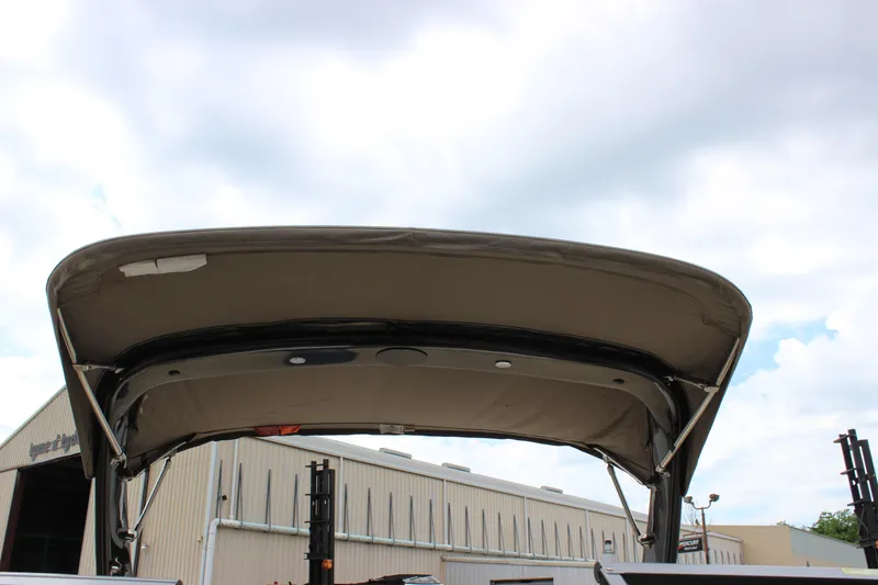 Slide: The Image of 2012 Regal 2100 RS Bowrider boat canopy against cloudy sky. - 30