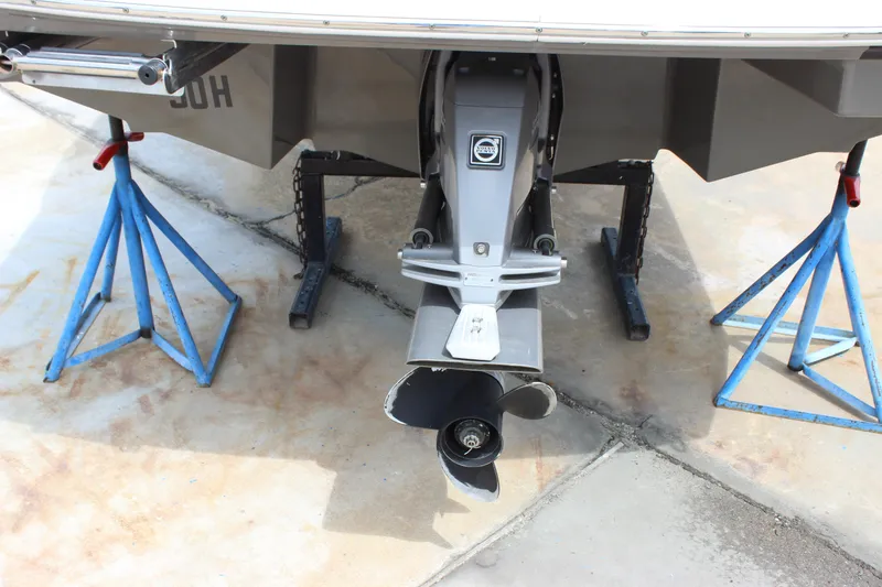 Slide: The Image of 2012 Regal 2100 RS Bowrider on stands, showing propeller and stern details. - 5