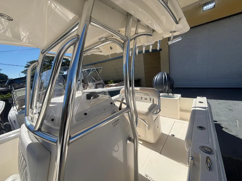 Slide: The Image of 2022 Cobia 237 Center Console boat with sleek design and spacious deck. - 11