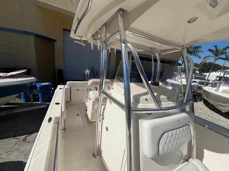 Slide: The Image of 2022 Cobia 237 Center Console boat with sleek design and spacious deck. - 12