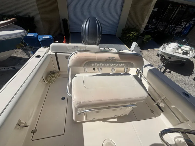 Slide: The Image of 2022 Cobia 237 Center Console boat interior with seating and storage. - 6