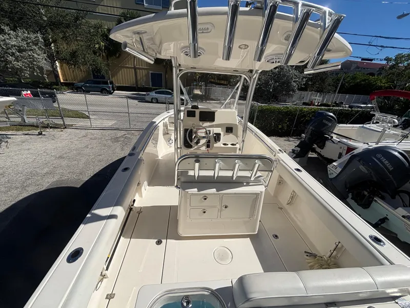 Slide: The Image of 2022 Cobia 237 Center Console boat with spacious deck and modern controls. - 7