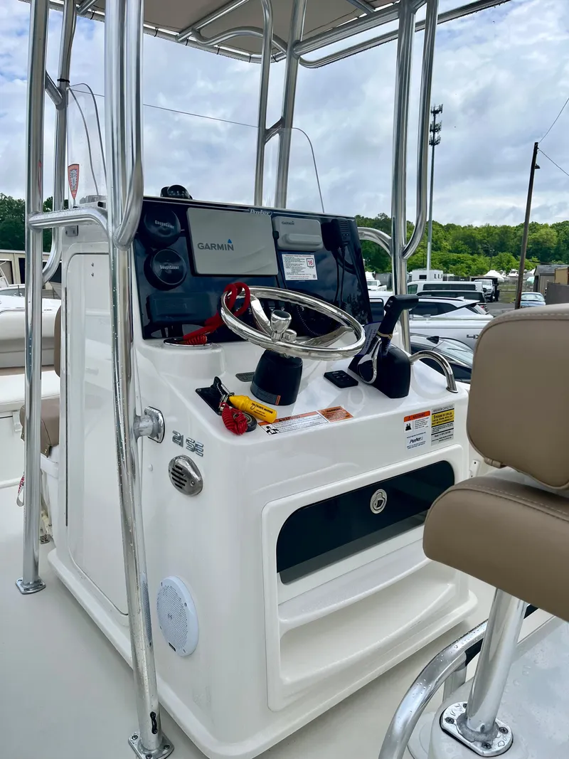Slide: The Image of 2019 Parker 21 Special Edition boat console with steering wheel and navigation equipment. - 4