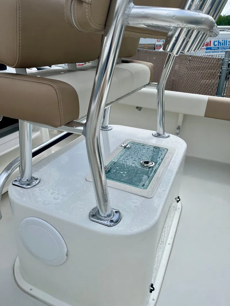 Slide: The Image of 2019 Parker 21 Special Edition boat seating with stainless steel frame and storage compartment. - 5