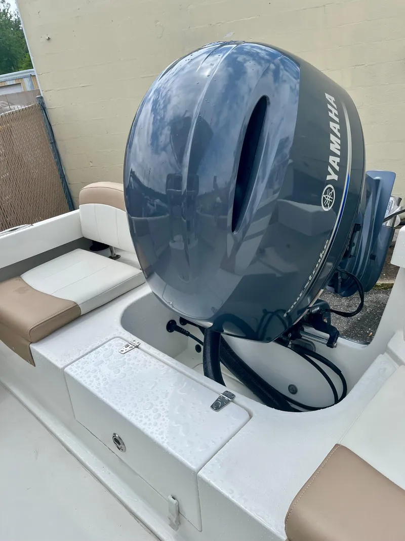 Slide: The Image of 2019 Parker 21 Special Edition boat with Yamaha outboard motor, featuring beige seating. - 7