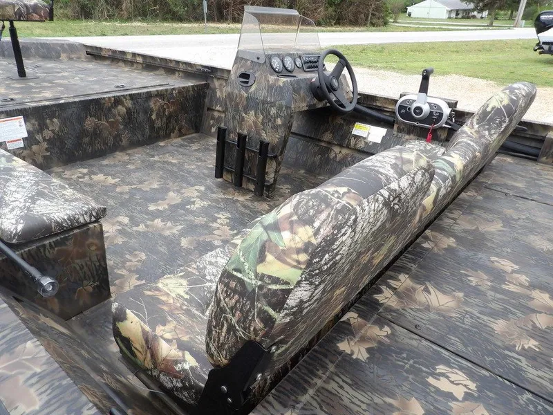 Slide: The Image of 2025 Crestliner 2070 Retriever SCHD boat with camouflage interior and steering console. - 10