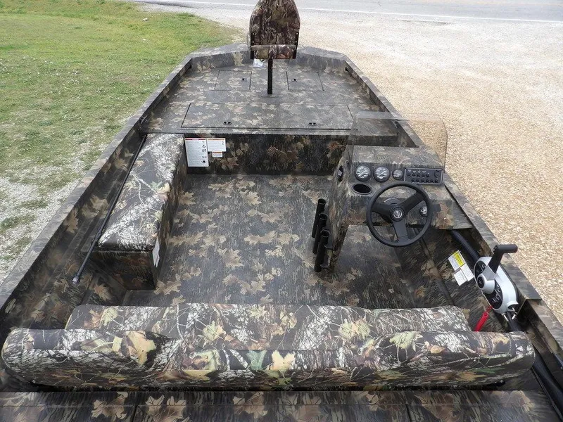 Slide: The Image of 2025 Crestliner 2070 Retriever SCHD boat with camouflage interior and steering console. - 13