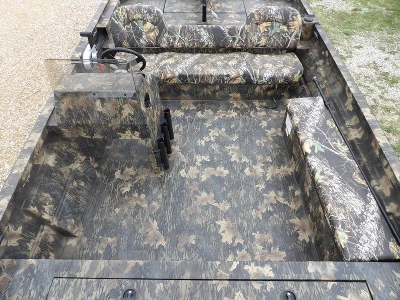 Slide: The Image of 2025 Crestliner 2070 Retriever SCHD boat interior with camouflage seating and flooring. - 21