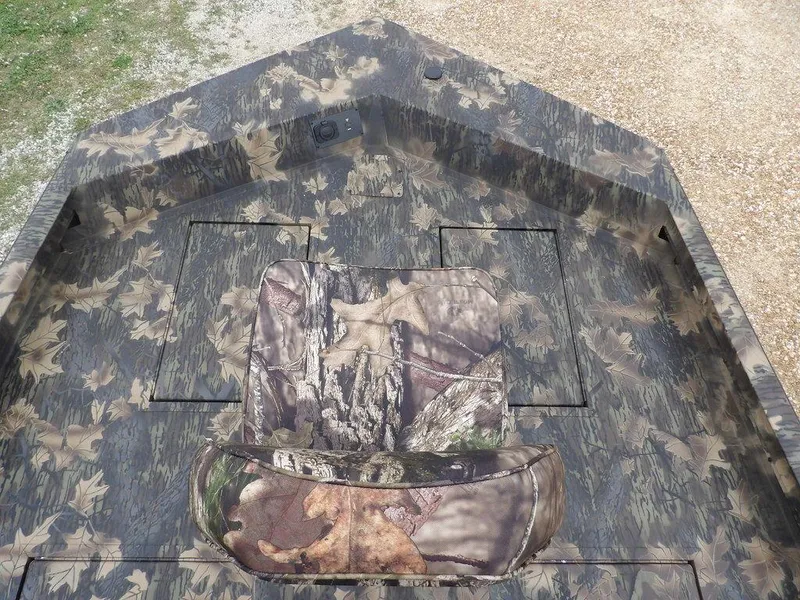 Slide: The Image of 2025 Crestliner 2070 Retriever SCHD boat with camouflage interior design. - 27