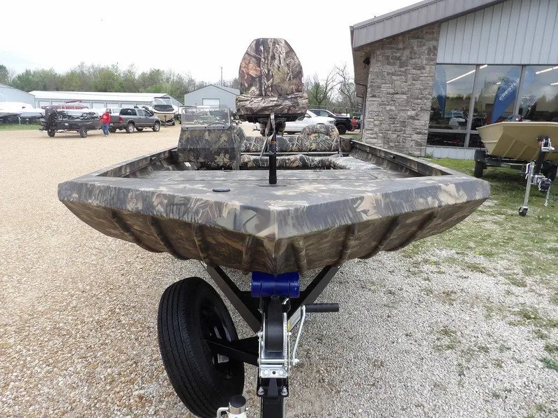Slide: The Image of 2025 Crestliner 2070 Retriever SCHD boat with camouflage design on a trailer. - 3