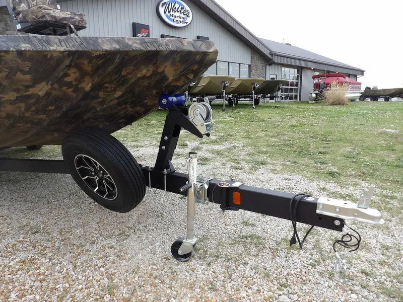 Slide: The Image of 2025 Crestliner 2070 Retriever SCHD boat on trailer, parked outside dealership. - 32