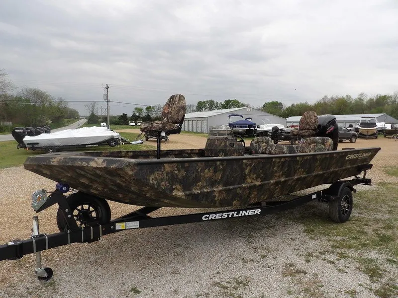 Slide: The Image of 2025 Crestliner 2070 Retriever SCHD boat with camouflage design on a trailer. - 5