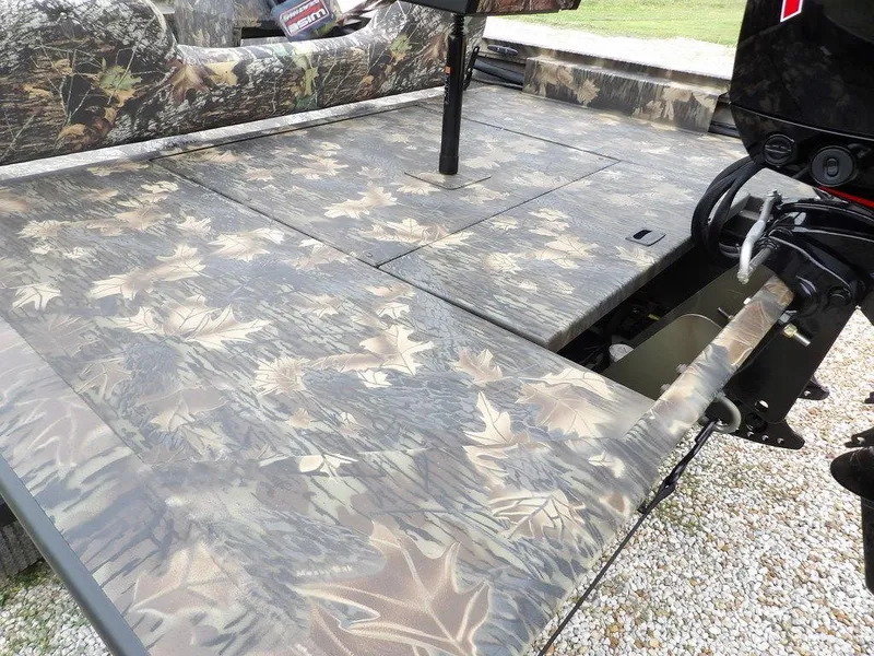 Slide: The Image of 2025 Crestliner 2070 Retriever SCHD boat with camouflage deck and seating. - 9