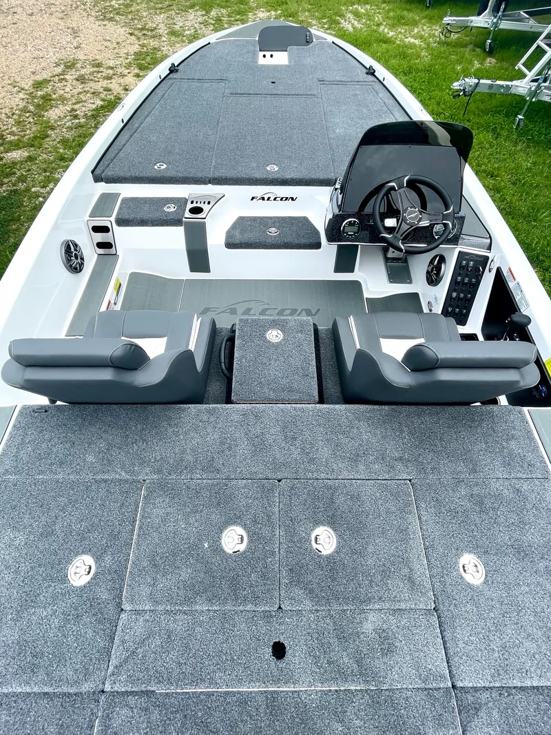Slide: The Image of 2025 Falcon F205 boat interior with modern dashboard and seating, featuring spacious deck layout. - 2