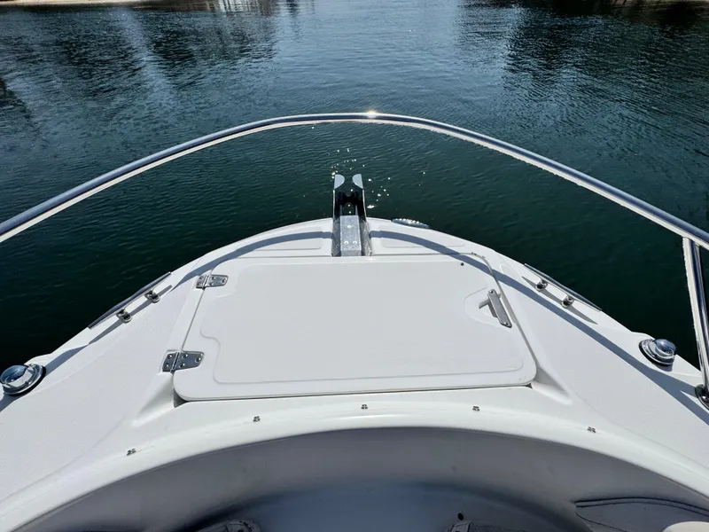Slide: The Image of Bow view of a 2005 Boston Whaler 210 Ventura on calm water. - 15