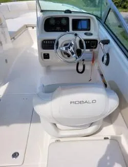 Slide: The Image of 2016 Robalo R227 Dual Console boat interior with steering wheel and dashboard. - 19