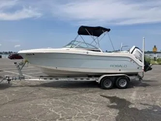 Slide: The Image of 2016 Robalo R227 Dual Console boat on trailer in parking lot. - 22
