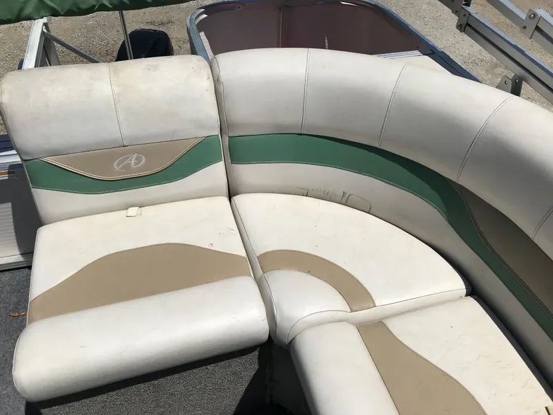 Slide: The Image of 2009 Avalon Eagle 16' boat seats with beige and green accents. - 11