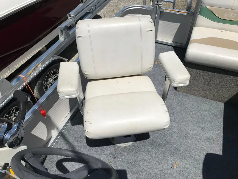 Slide: The Image of White captain's chair on 2009 Avalon Eagle 16' boat deck. - 12