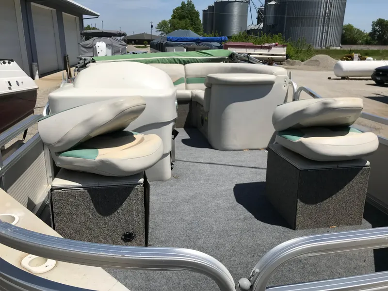 Slide: The Image of 2009 Avalon Eagle 16' pontoon boat interior with seating and storage compartments. - 7