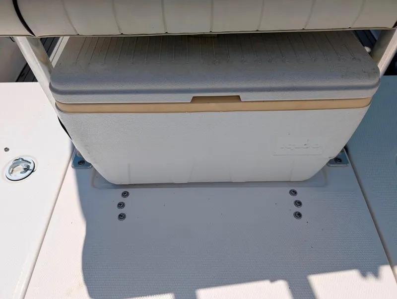 Slide: The Image of 2021 Yamaha Boats 195 FSH Sport cooler storage area on deck. - 40