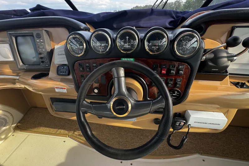 Slide: The Image of Helm of 2001 Carver 466 Motor Yacht with gauges and steering wheel. - 31