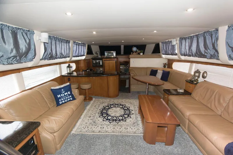 Slide: The Image of Luxurious interior of 2001 Carver 466 Motor Yacht with elegant seating and decor. - 33