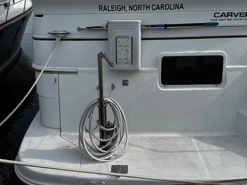 Slide: The Image of 2001 Carver 466 Motor Yacht docked, featuring hose and equipment, Raleigh, North Carolina. - 8