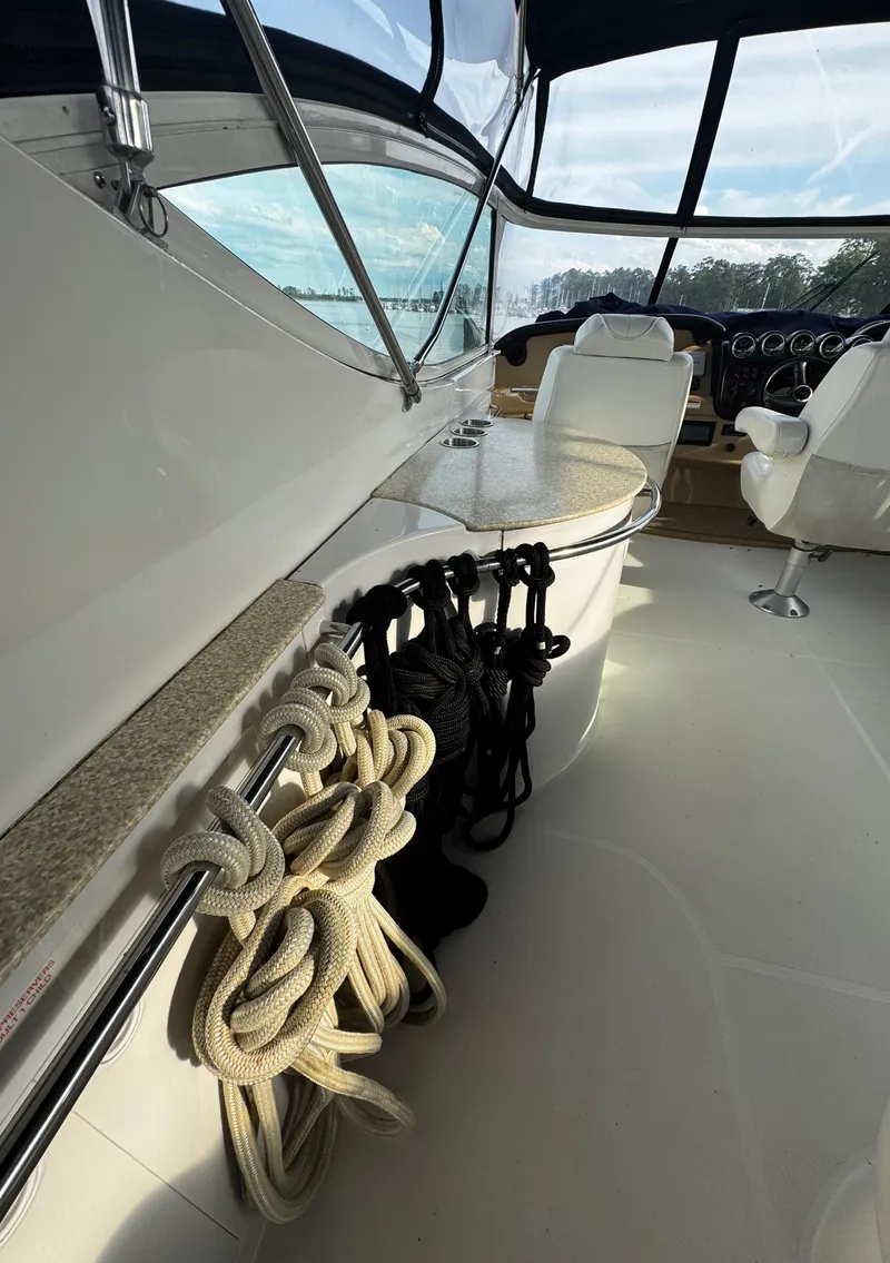 Slide: The Image of 2001 Carver 466 Motor Yacht interior with ropes and seating area. - 22