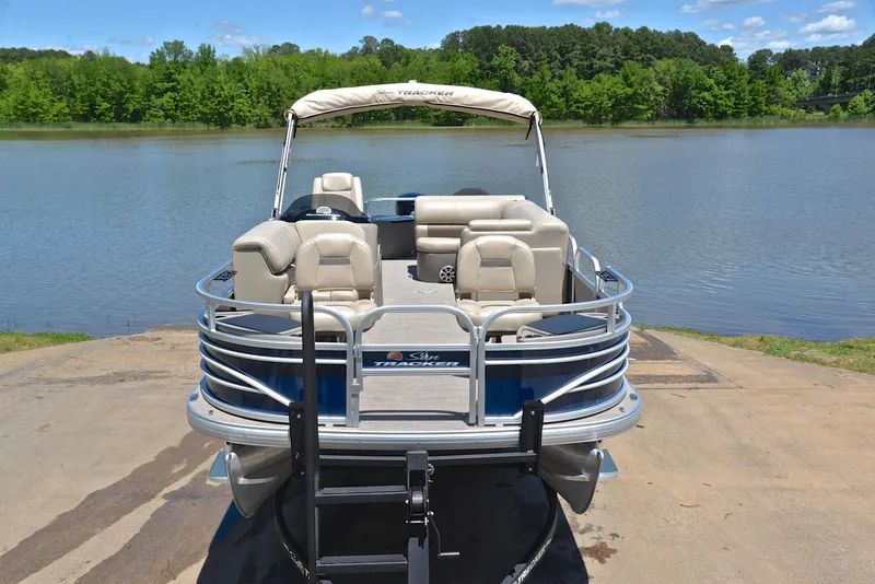 Slide: The Image of 2023 Sun Tracker Fishin Barge 20 DLX pontoon boat by a serene lake. - 17