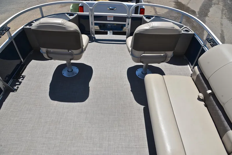 Slide: The Image of 2023 Sun Tracker Fishin Barge 20 DLX interior with seating and spacious deck. - 21