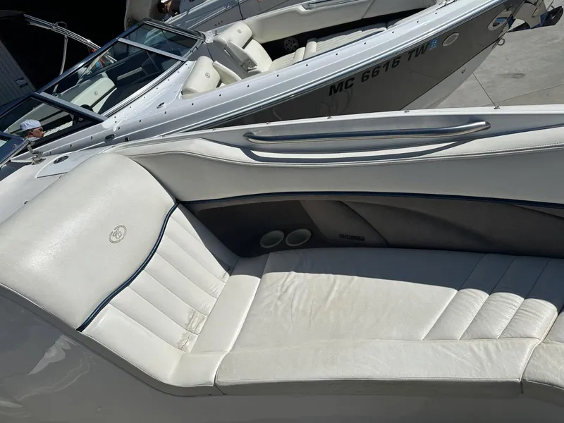 Slide: The Image of 2004 Cobalt 282 boat with white leather seating and sleek design. - 11