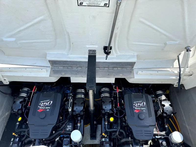 Slide: The Image of Twin MerCruiser 350 MAG engines in a 2004 Cobalt 282 boat engine compartment. - 17