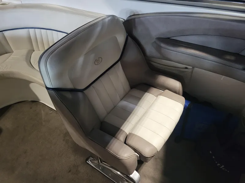Slide: The Image of 2004 Cobalt 282 boat interior with beige and gray seating. - 6